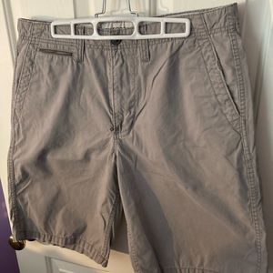 Men’s Express distressed style flat front shorts. Size: 33